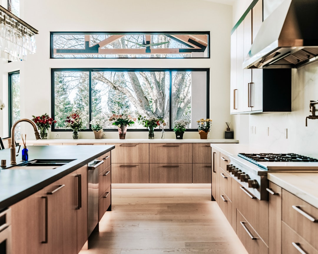 Custom warm wood cabinetry in a luxury kitchen with quartz countertops