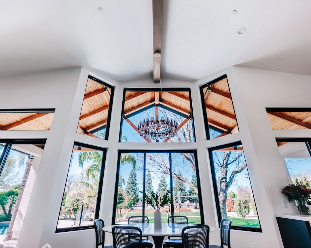 What is a design build contractor — luxury home interior with vaulted ceilings, exposed beams, and architectural windows