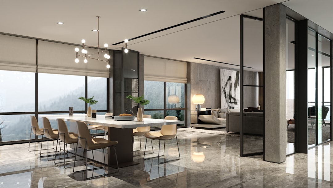 Luxury minimalist living and dining space designed and built by a design-build contractor