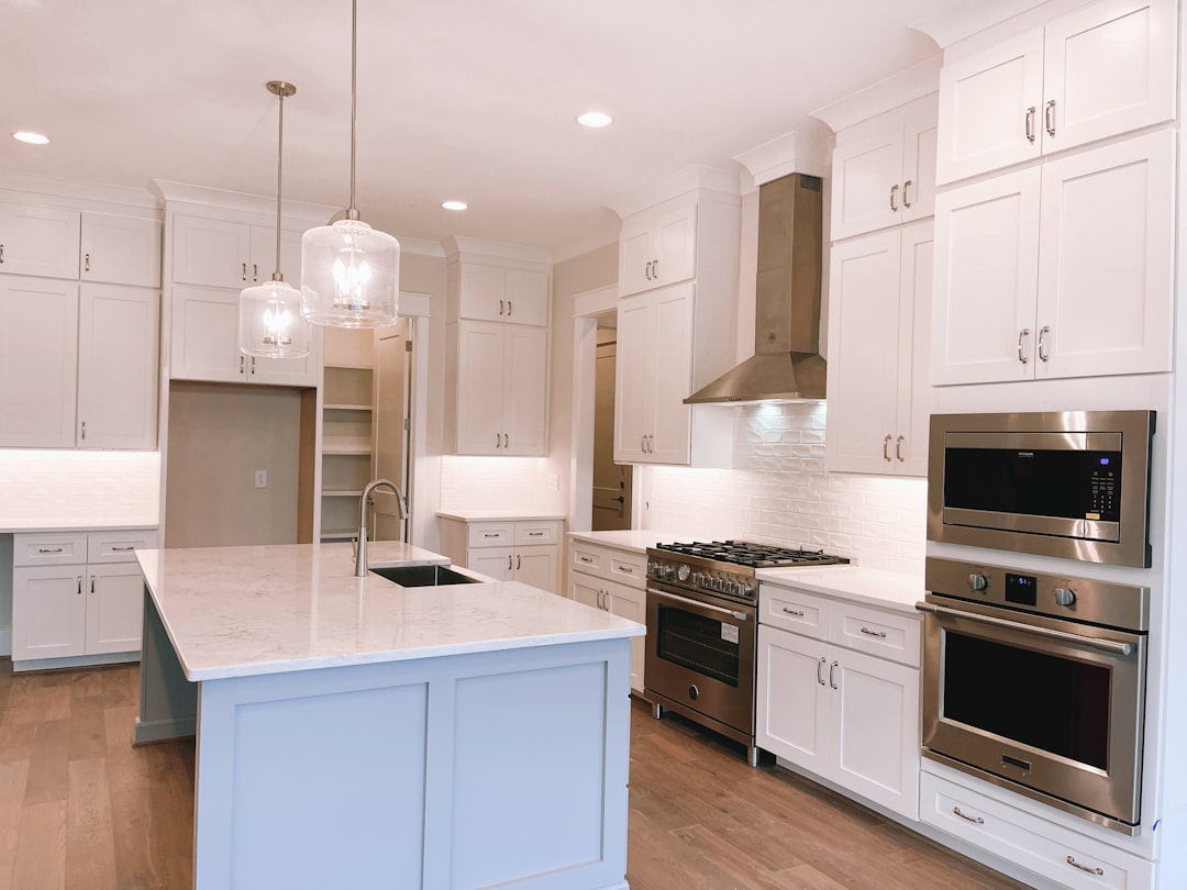 Stock white kitchen cabinets compared with custom cabinetry