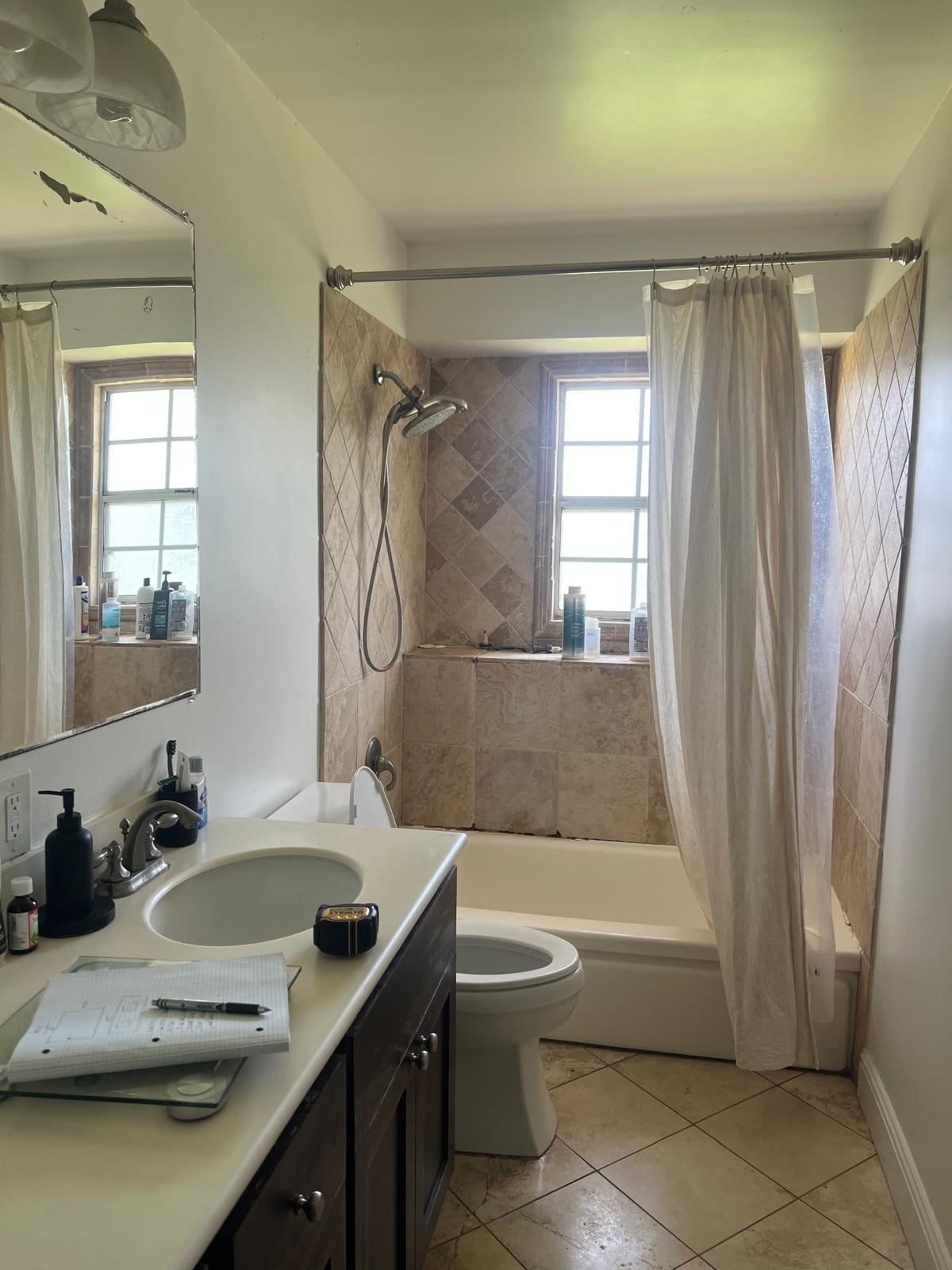 Before: Anaheim guest bathroom with diamond stone tile and oak vanity